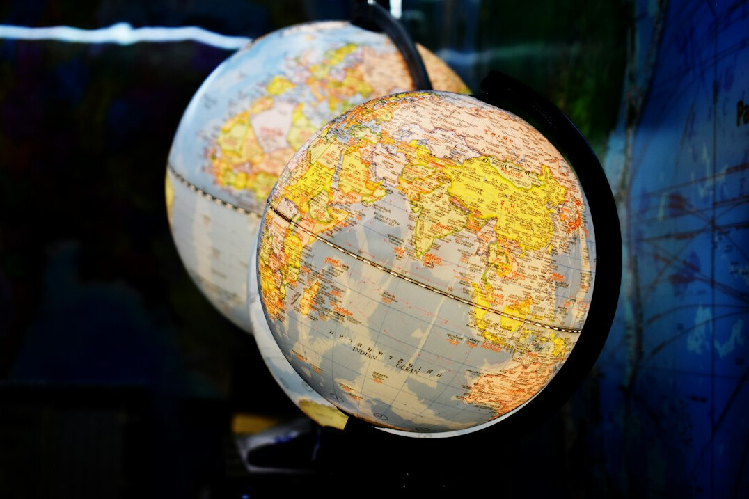 Illuminated world map globe at night